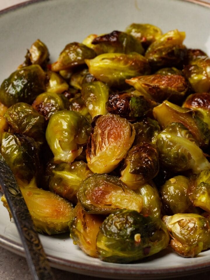 A bowl of baked Brussels sprouts.